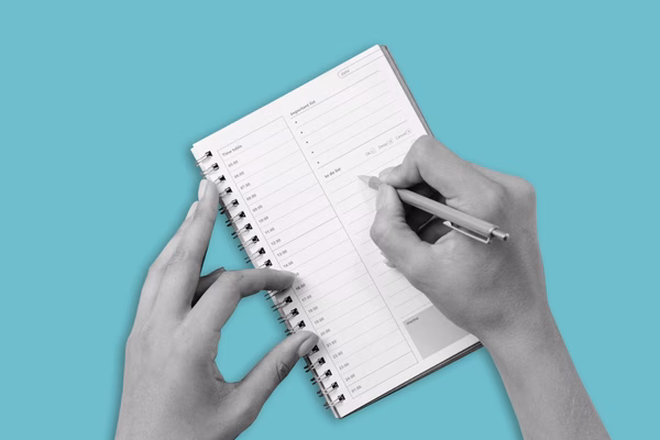 Writing in a calendar.