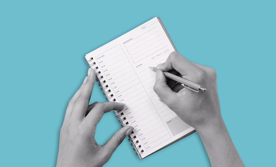Writing in a calendar.