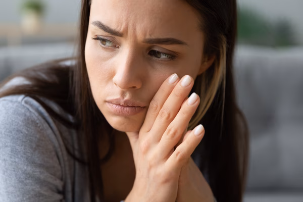 Concerned woman frowning