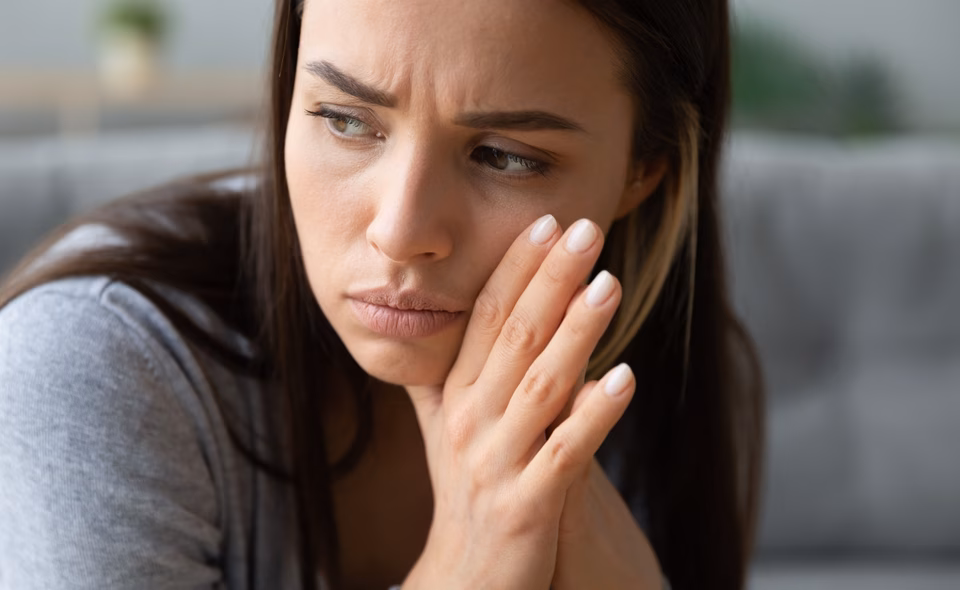 Concerned woman frowning
