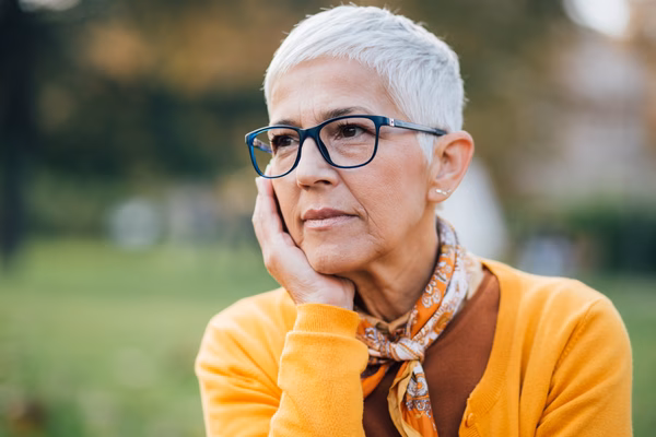 Older woman looking into distance