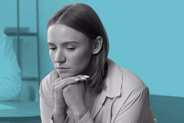 A women looking downcast.