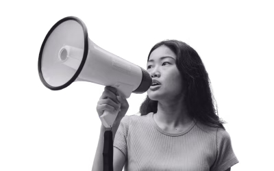 Photo of an East Asian woman with a megaphone